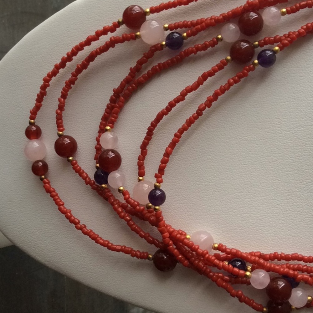 Impressive coral multi gem layer necklace